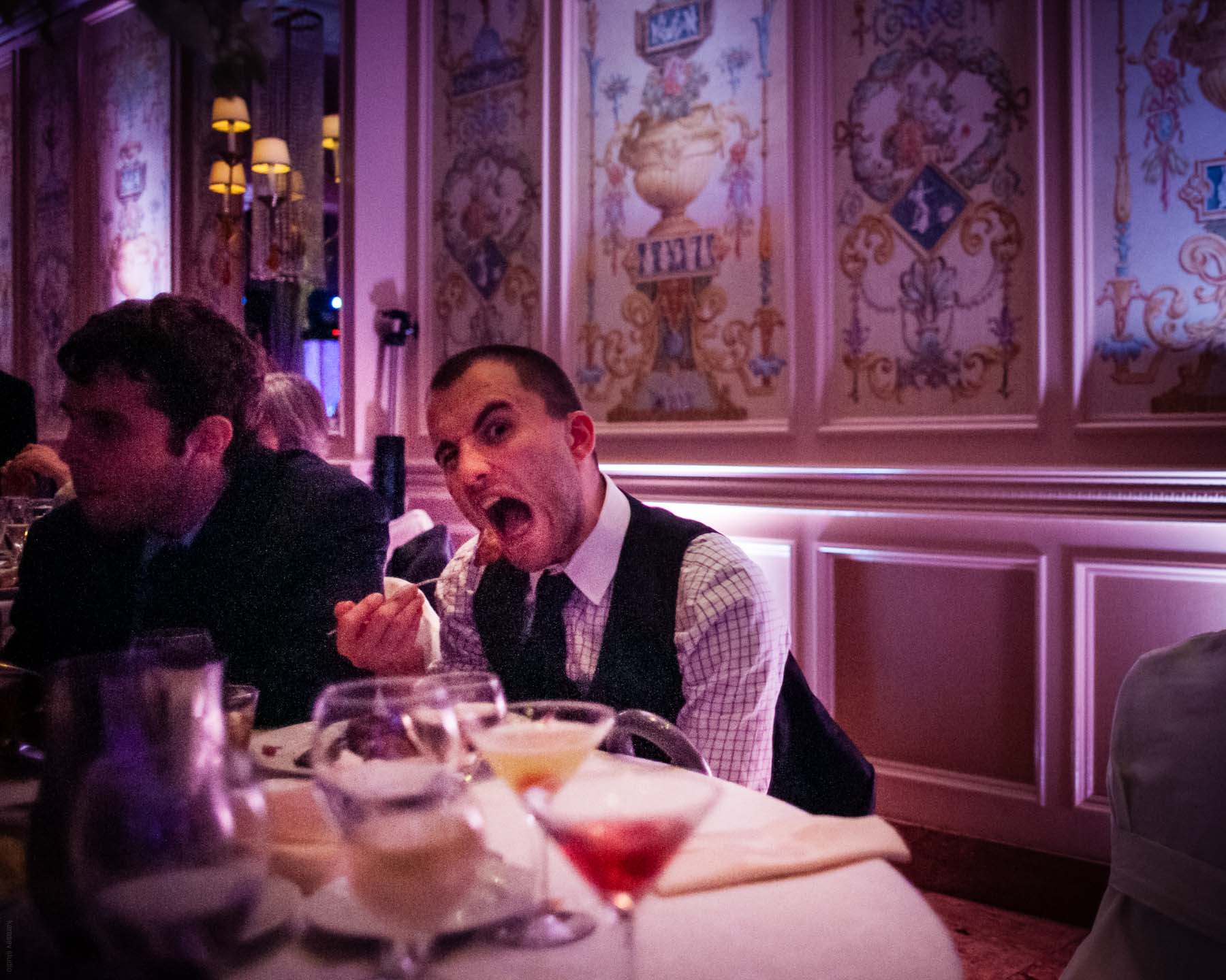 Seven-year-old girl uses a full frame DSLR to capture a wedding guest eating